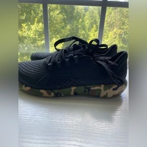 never worn before, black and camo athletic shoes.